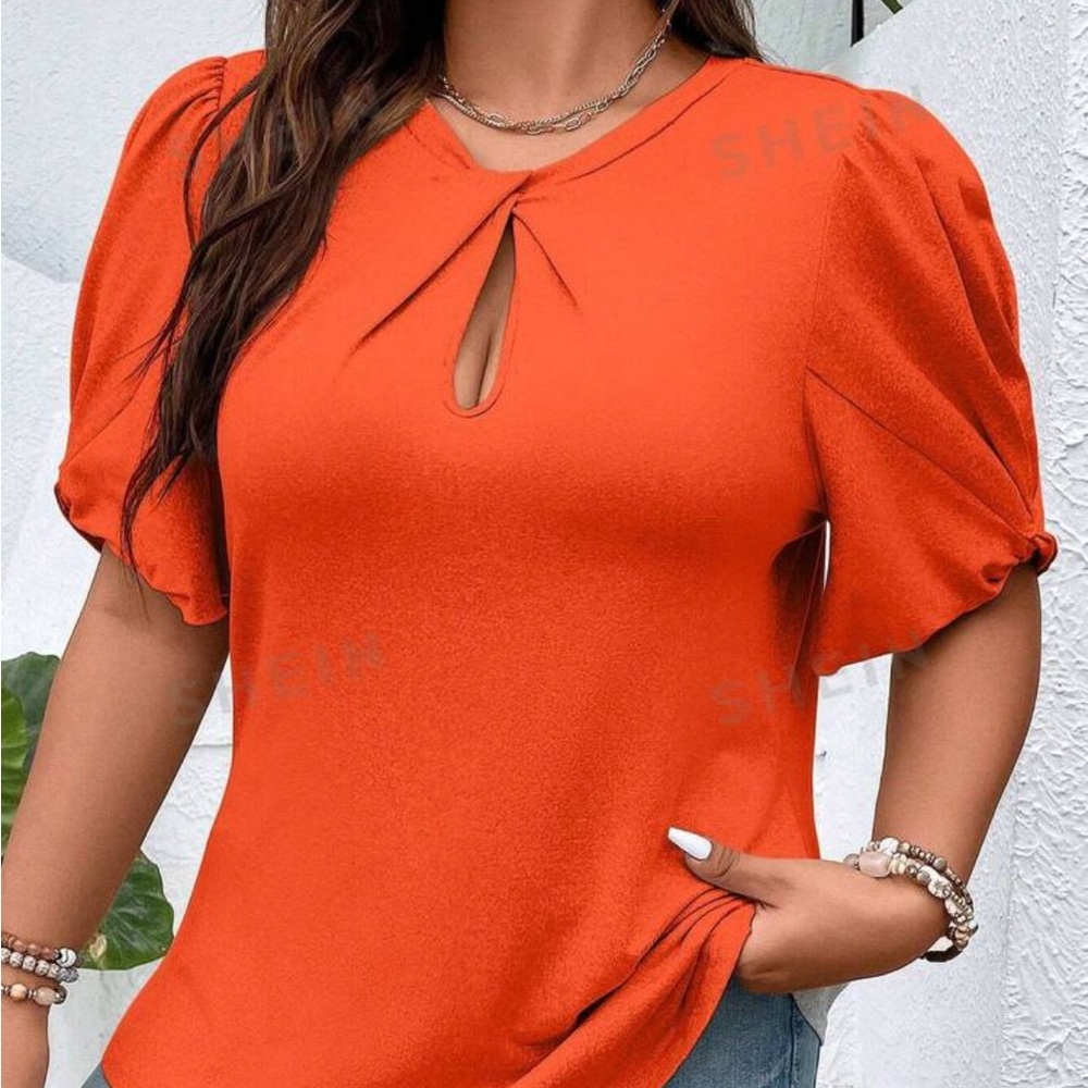 Orange top,  never worn in bag!!!